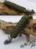 Bild von Paracord Schlüsselanhänger mit Nashorn Kopf - olive - moos grün